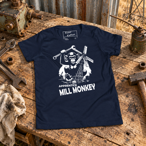 Apprentice Mill Monkey Kids Tee on a rural Australian workshop bench